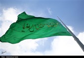 مراسم اهتزاز پرچم امام رضا (ع) بر فراز شهر همدان