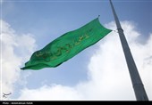 مراسم اهتزاز پرچم امام رضا (ع) بر فراز شهر همدان