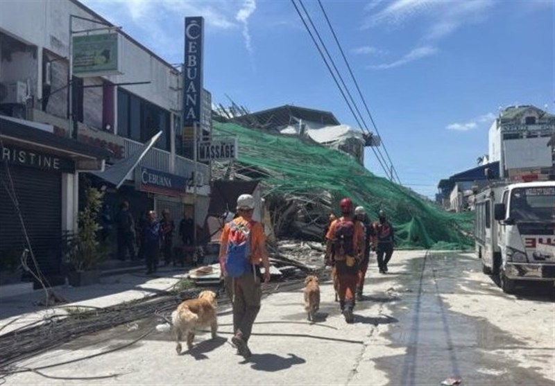 Rescuers Search for More than 20 Trapped after Philippines Building Collapse