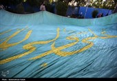 اهتزاز پرچم مزین به نام علی ولی الله (ع) بر فراز شهر همدان