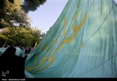 اهتزاز پرچم مزین به نام علی ولی الله (ع) بر فراز شهر همدان