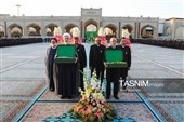 آیین تعویض پرچم گنبد حرم مطهر رضوی