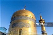 آیین تعویض پرچم گنبد حرم مطهر رضوی