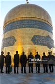 آیین تعویض پرچم گنبد حرم مطهر رضوی