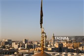 آیین تعویض پرچم گنبد حرم مطهر رضوی