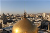 آیین تعویض پرچم گنبد حرم مطهر رضوی