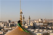 آیین تعویض پرچم گنبد حرم مطهر رضوی