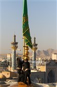 آیین تعویض پرچم گنبد حرم مطهر رضوی