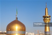 آیین تعویض پرچم گنبد حرم مطهر رضوی