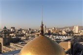 آیین تعویض پرچم گنبد حرم مطهر رضوی