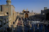 تعویض پرچم و نصب کتیبه‌های شهادت امام حسن عسکری(ع) در حرم مطهر رضوی