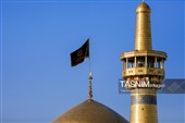 تعویض پرچم و نصب کتیبه‌های شهادت امام حسن عسکری(ع) در حرم مطهر رضوی