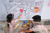 رنگ آمیزی دیوارنگاره توسط کودکان جهان اسلام یادبود شهدای مدرسه میناب