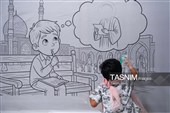 رنگ آمیزی دیوارنگاره توسط کودکان جهان اسلام یادبود شهدای مدرسه میناب