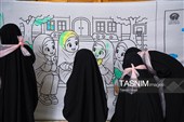 رنگ آمیزی دیوارنگاره توسط کودکان جهان اسلام یادبود شهدای مدرسه میناب